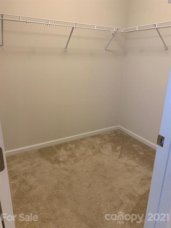 733 Dynamo Street Northwest Concord, NC 28027 - Photo 14 of 24 a view of a room with racks on the wall