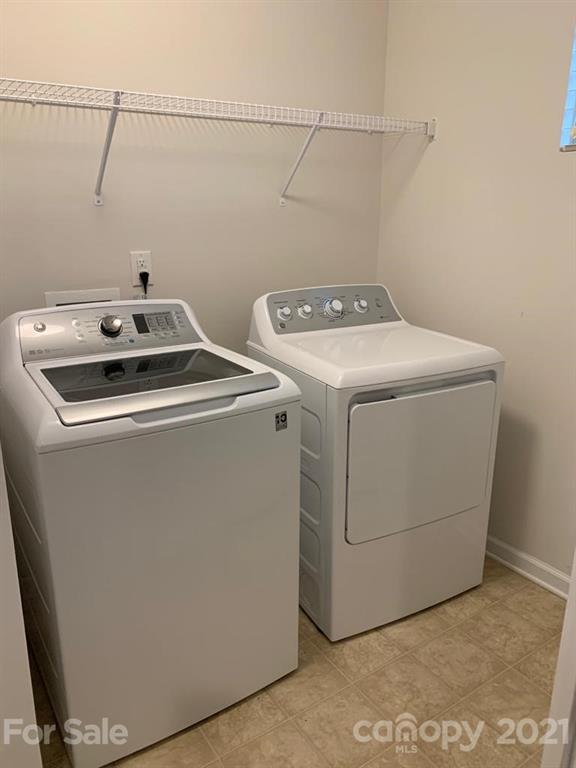 733 Dynamo Street Northwest Concord, NC 28027 - Photo 22 of 24 a utility room with dryer and washer