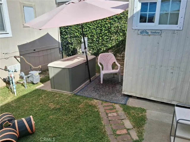 a view of a backyard with sitting area