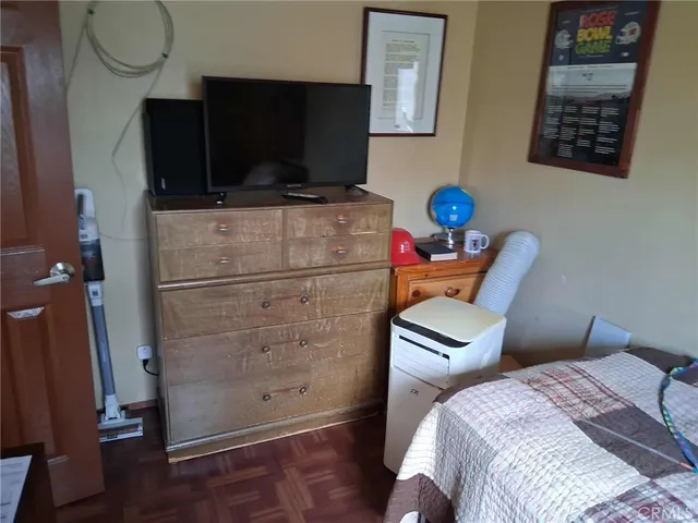 a bedroom with furniture and a window