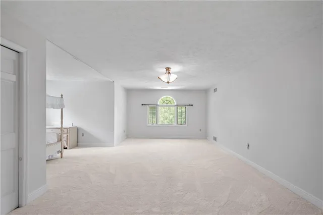 a view of empty room with a window