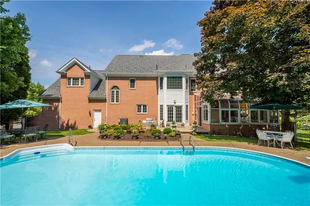 a front view of house with yard and outdoor seating