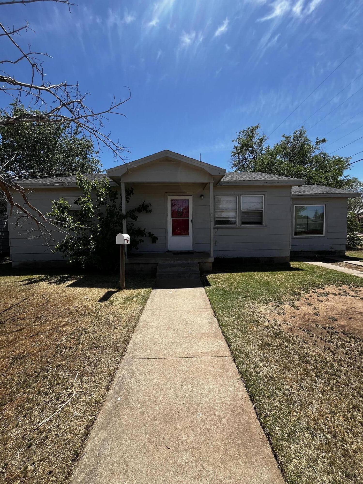 523 55th Street Lubbock, TX 79404 - Photo 1 of 7 a front view of a house with a yard