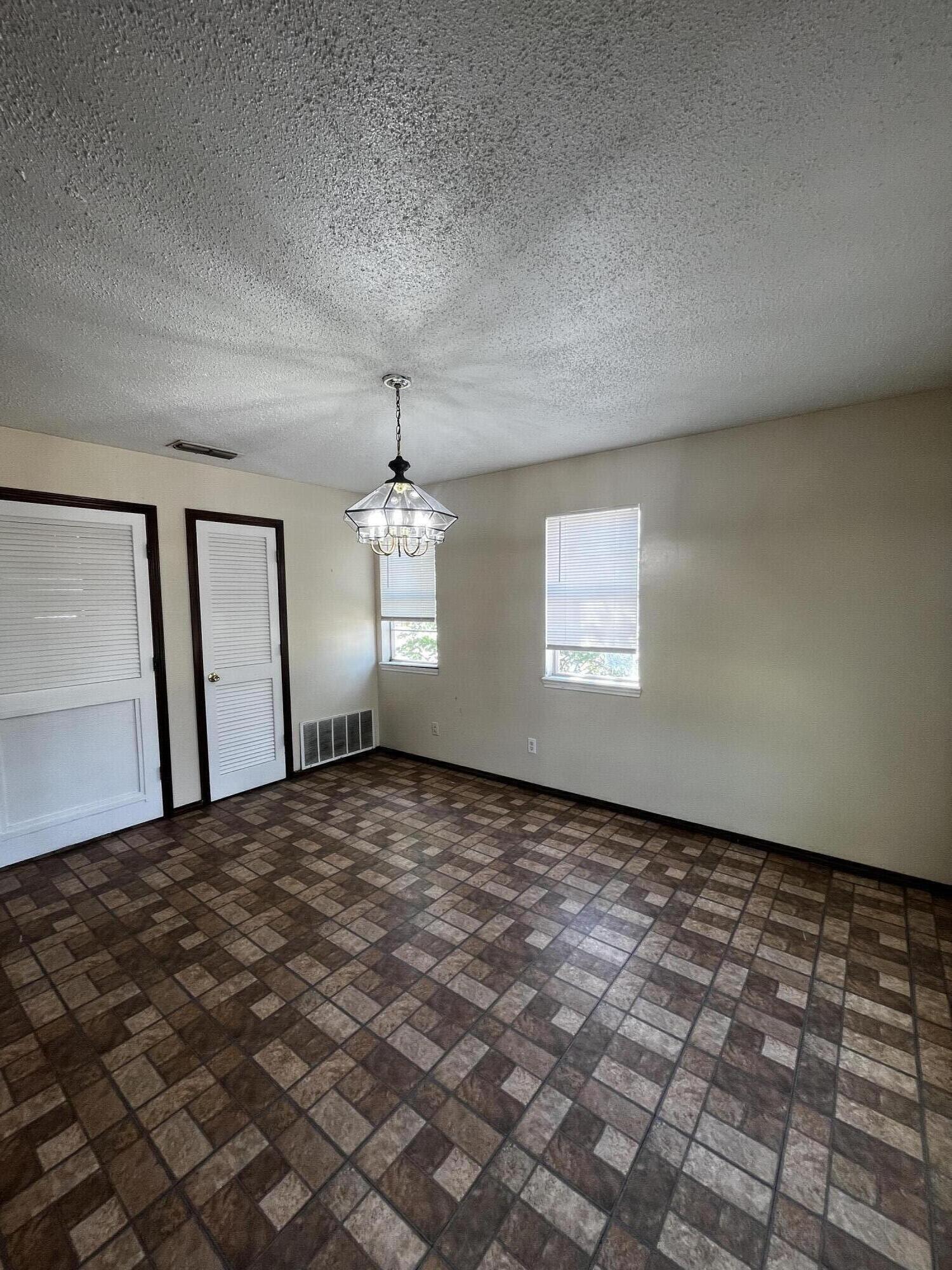 523 55th Street Lubbock, TX 79404 - Photo 3 of 7 a view of empty room with window