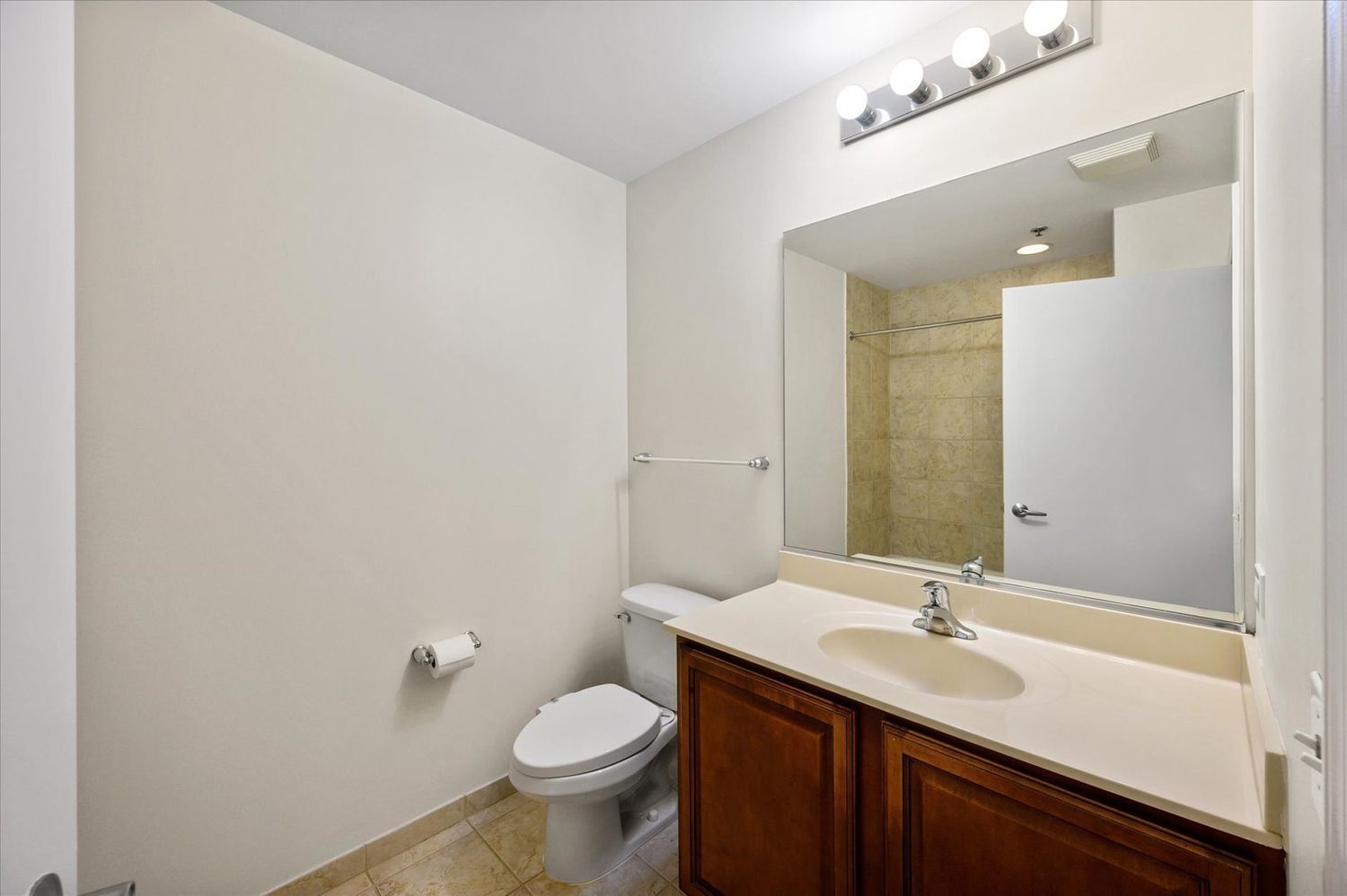 1255 South State Street, Unit 1913 Chicago, IL 60605 - Photo 9 of 21 a bathroom with a sink a toilet and mirror
