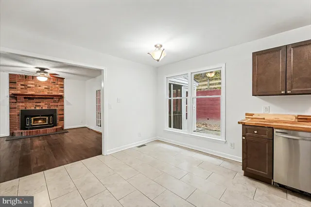 a kitchen that has a sink and a stove in it