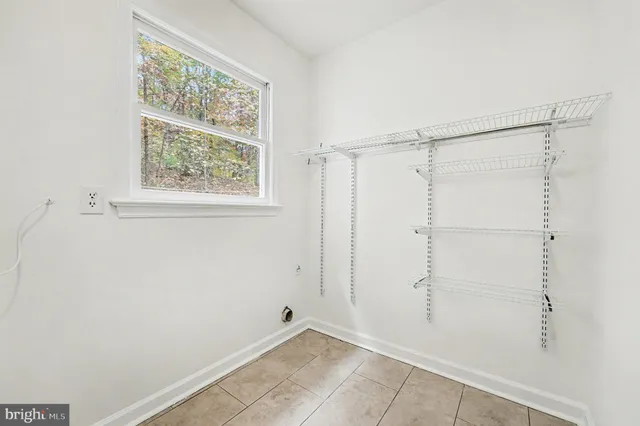 a view of an empty room with stairs