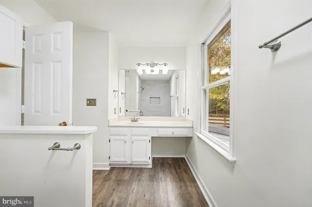 a white bath tub sitting next to a window