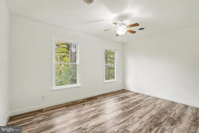 a view of a house with a tree