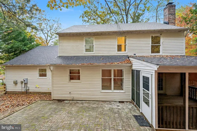 a front view of a building with glass top table and chairs