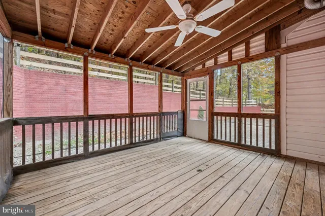 a view of a balcony with wooden floor