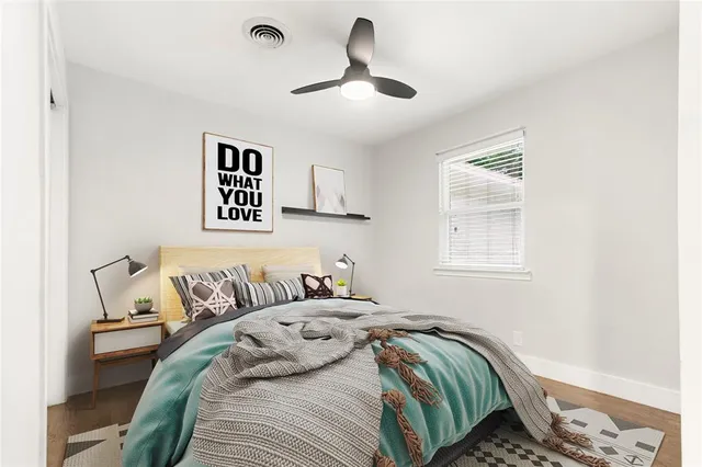 a bedroom with a bed and a window