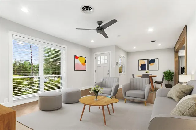 a living room with furniture and a large window