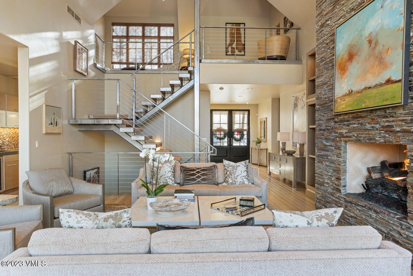 83 Eagle River Road Edwards, CO 81632 - Photo 1 of 64 a living room with furniture and a chandelier