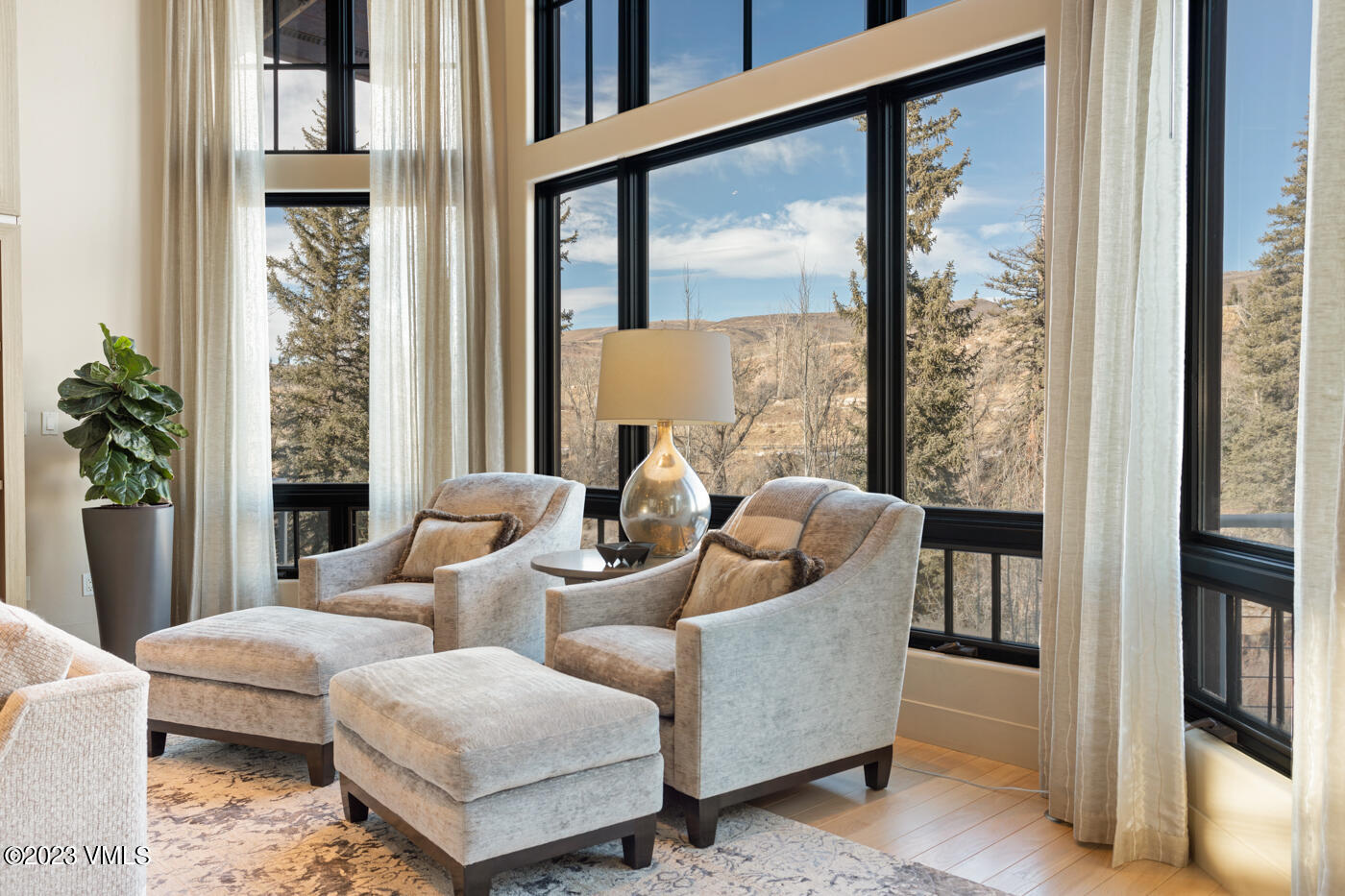 83 Eagle River Road Edwards, CO 81632 - Photo 12 of 64 a living room with furniture and a large window