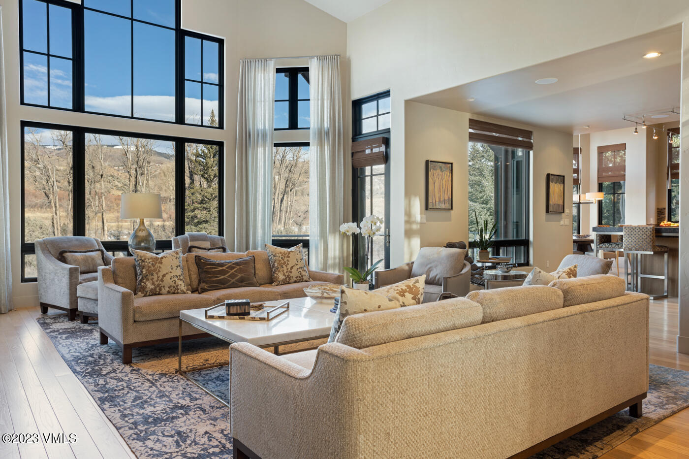 83 Eagle River Road Edwards, CO 81632 - Photo 13 of 64 a living room with furniture and a large window