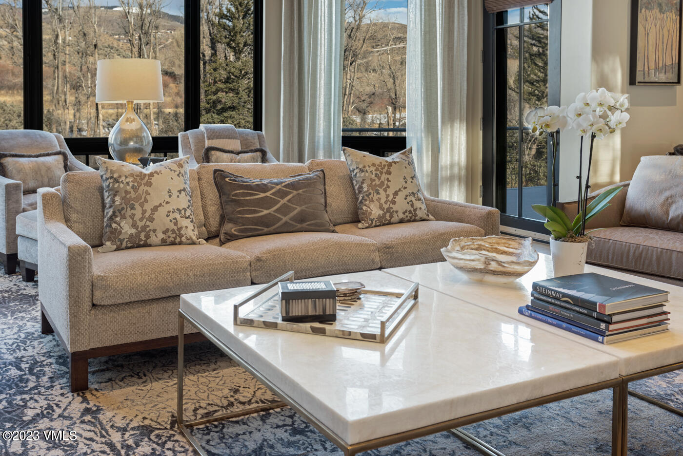 83 Eagle River Road Edwards, CO 81632 - Photo 15 of 64 a living room with furniture and a large window