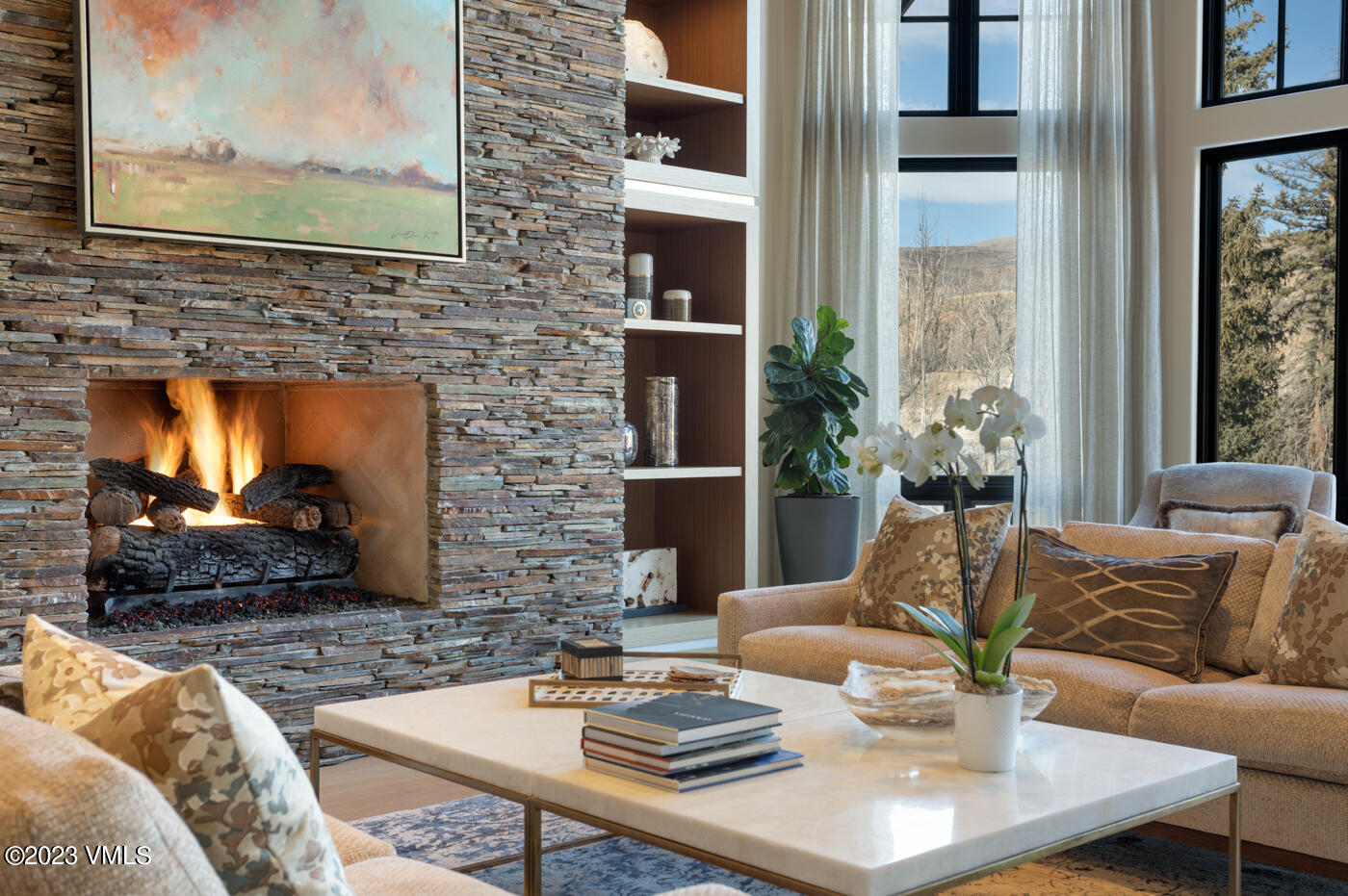 83 Eagle River Road Edwards, CO 81632 - Photo 16 of 64 a living room with furniture wooden floor and a fireplace
