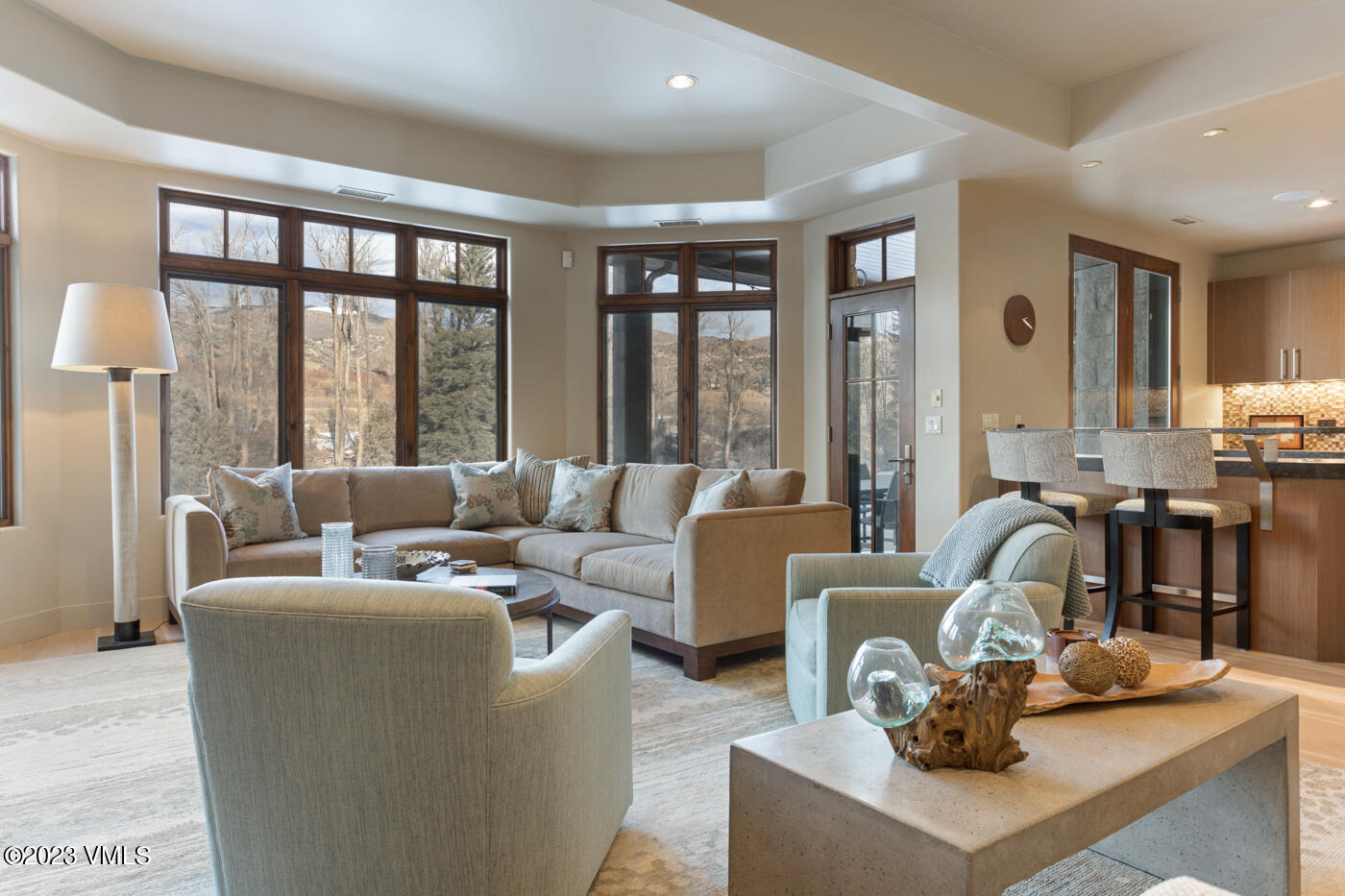 83 Eagle River Road Edwards, CO 81632 - Photo 29 of 64 a living room with furniture and large windows