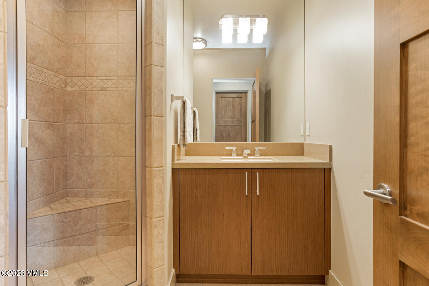 83 Eagle River Road Edwards, CO 81632 - Photo 41 of 64 a bathroom with a sink a mirror and vanity