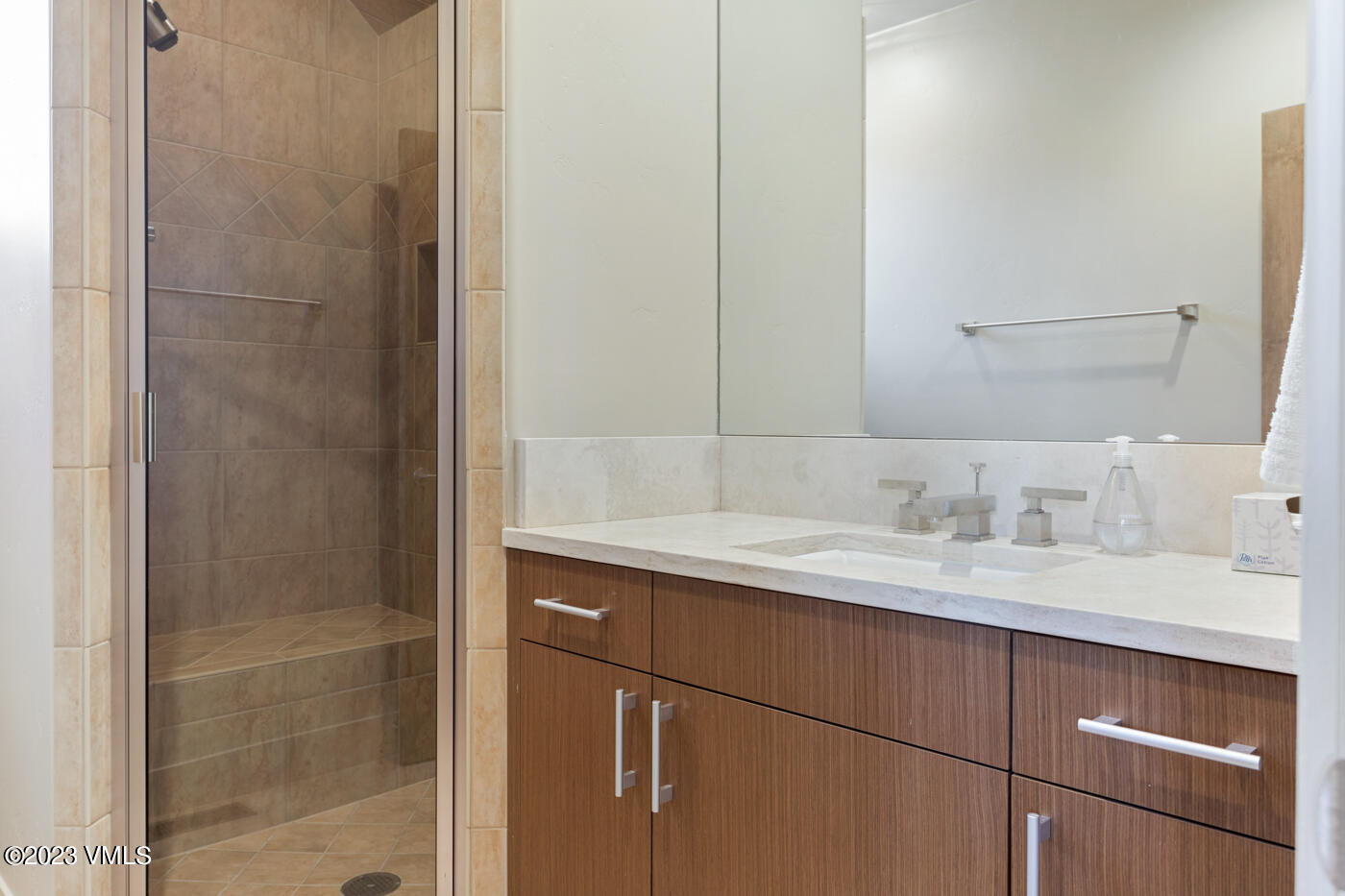 83 Eagle River Road Edwards, CO 81632 - Photo 48 of 64 a bathroom with a granite countertop sink and a mirror