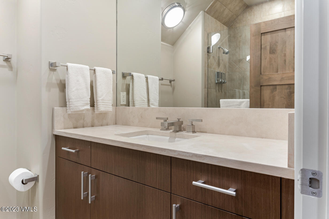 83 Eagle River Road Edwards, CO 81632 - Photo 49 of 64 a bathroom with a sink and a mirror