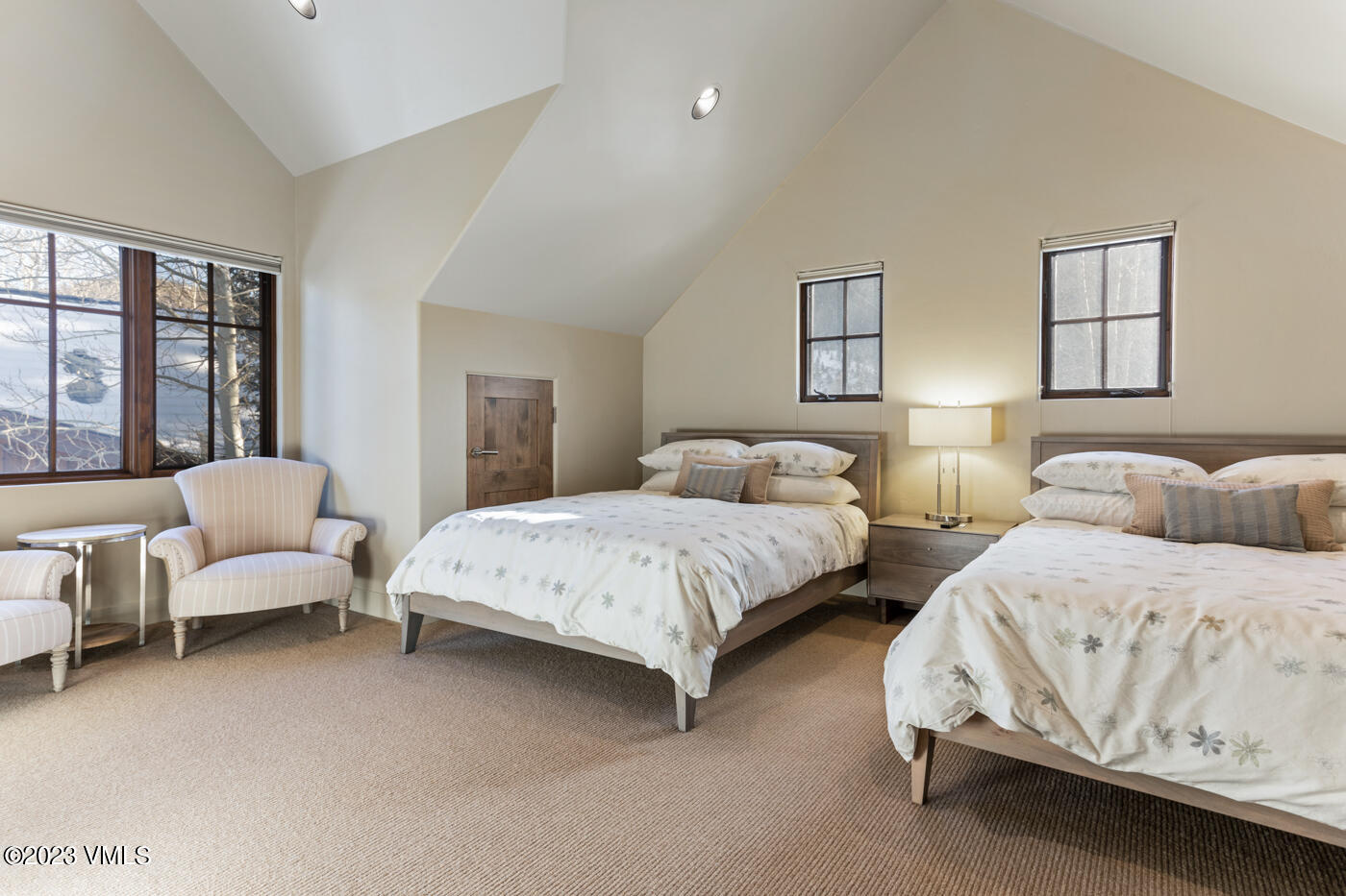 83 Eagle River Road Edwards, CO 81632 - Photo 50 of 64 a spacious bedroom with two beds and a couch