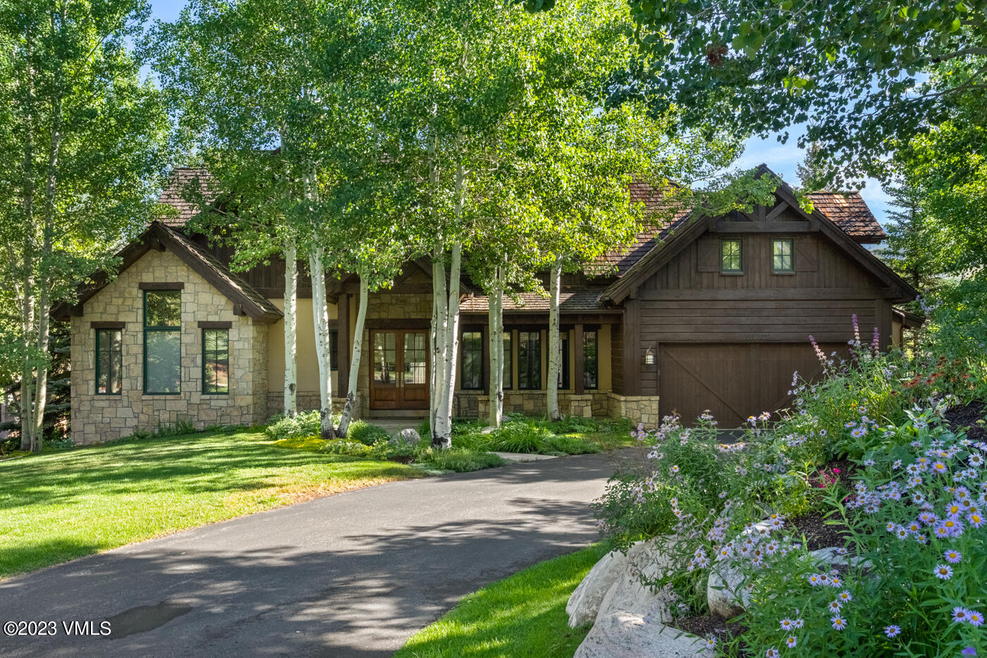 83 Eagle River Road Edwards, CO 81632 - Photo 52 of 64 a front view of a house with a yard