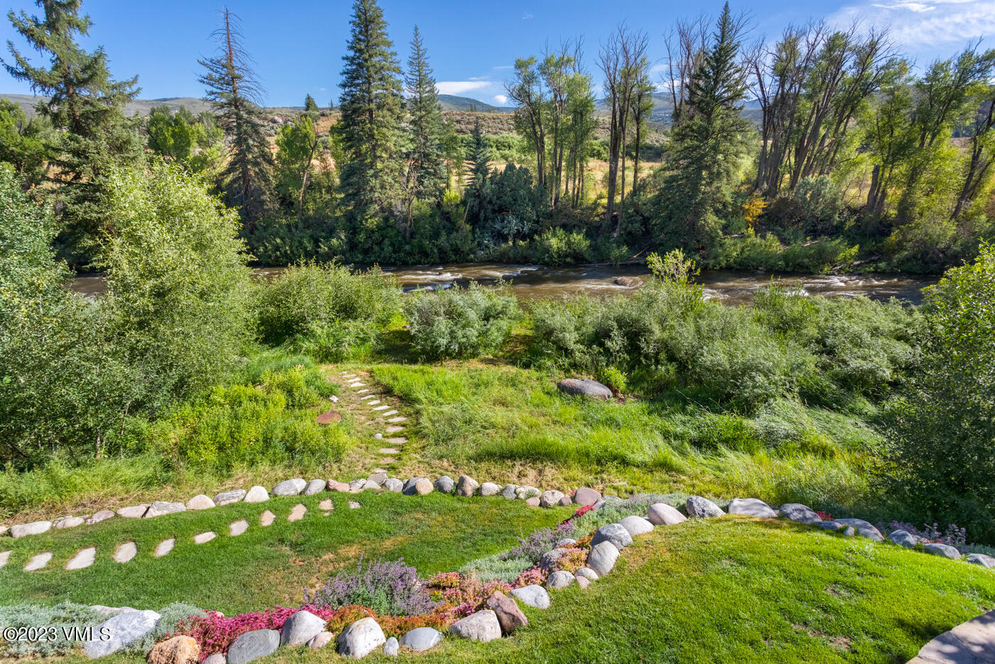 83 Eagle River Road Edwards, CO 81632 - Photo 54 of 64 a view of a bunch of flowers and trees