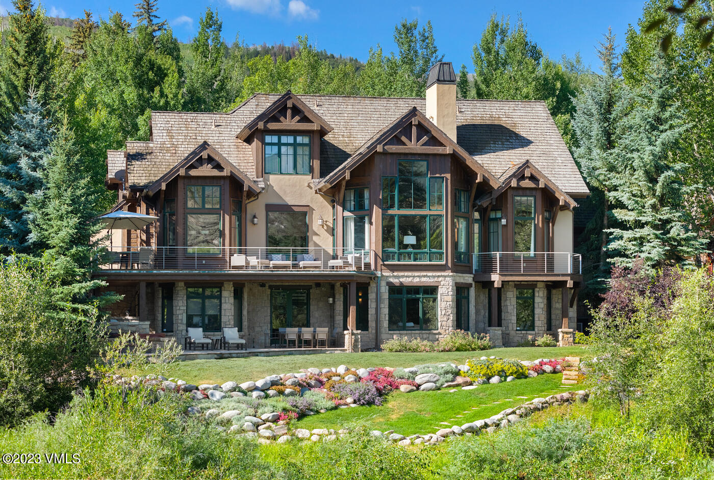 83 Eagle River Road Edwards, CO 81632 - Photo 63 of 64 a front view of a house with a yard