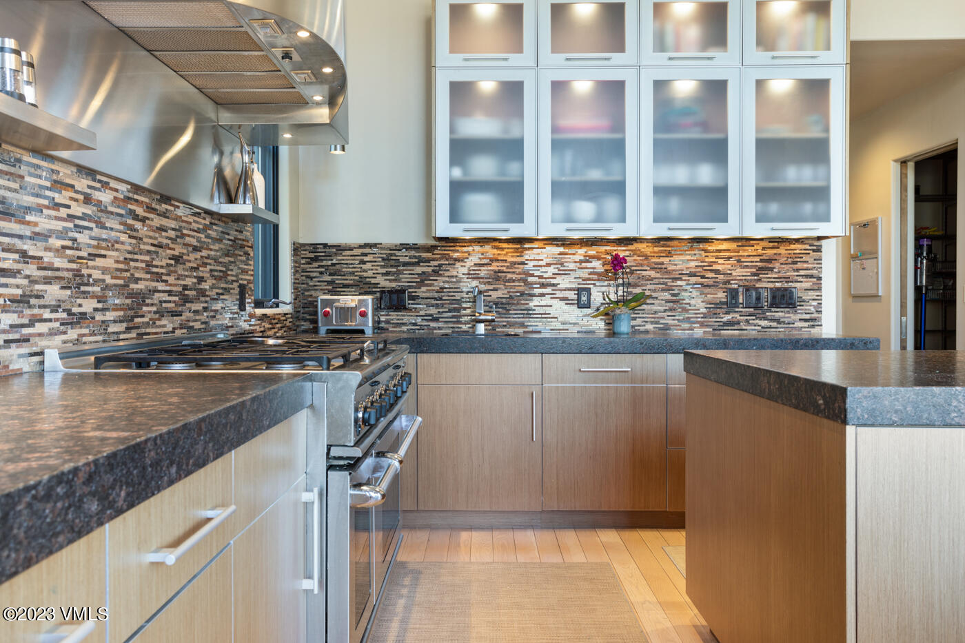 83 Eagle River Road Edwards, CO 81632 - Photo 8 of 64 a kitchen with a sink and a refrigerator
