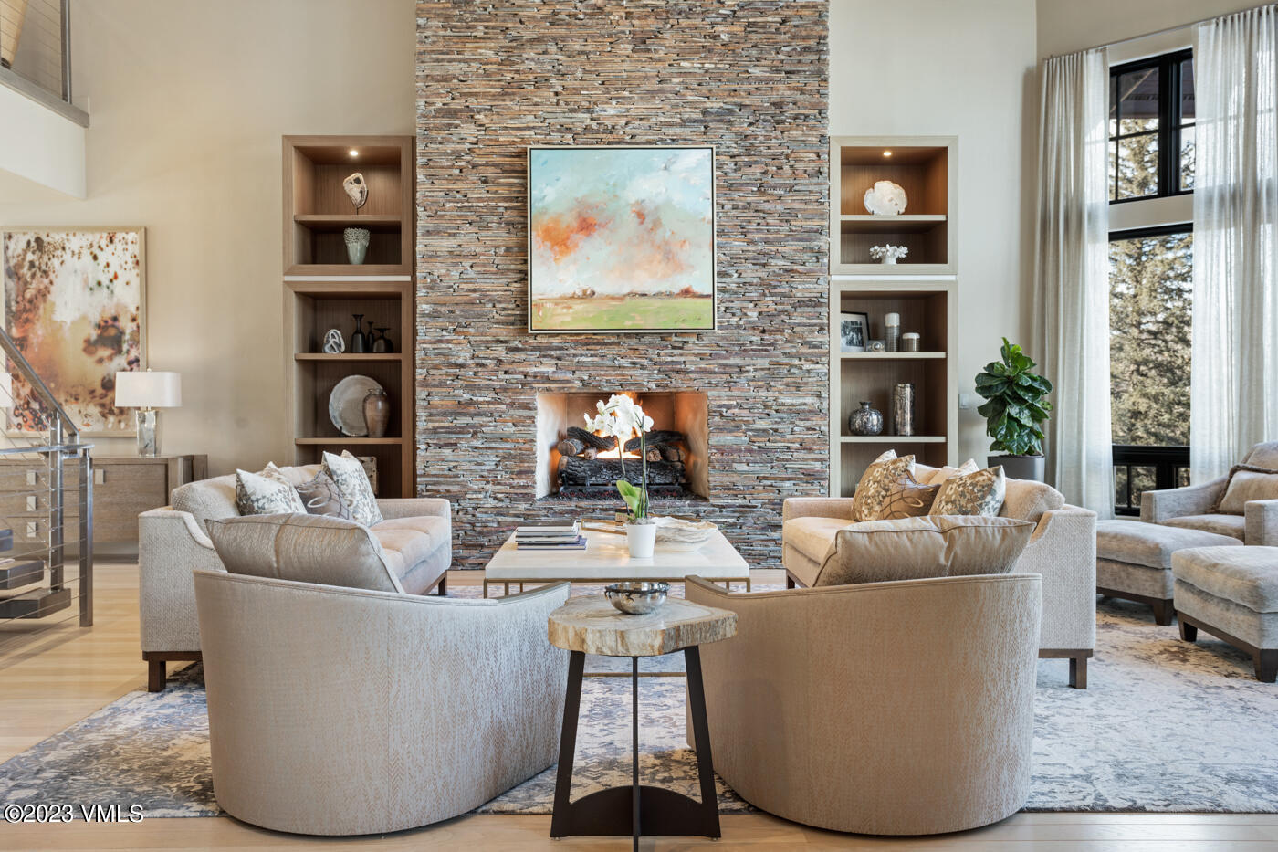 83 Eagle River Road Edwards, CO 81632 - Photo 10 of 64 a living room with fireplace furniture and a large window