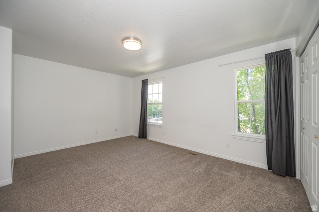 1799 West 1110th Street North Provo, UT 84604 - Photo 16 of 24 Spacious room featuring neutral carpeting and white walls