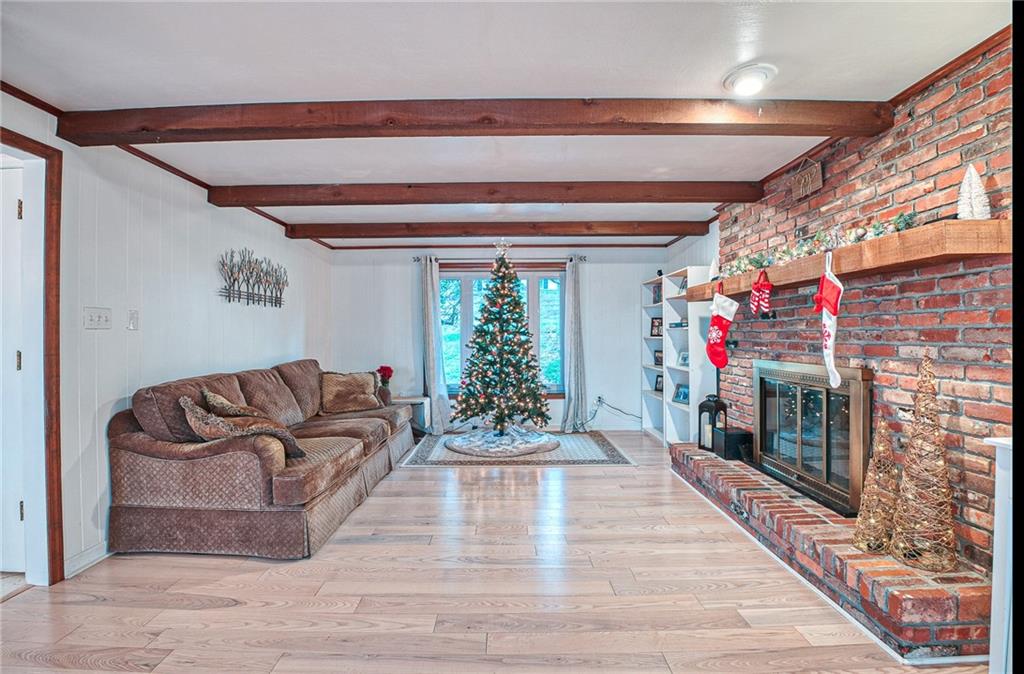 3223 Ridgeway Road Greensburg, PA 15601 - Photo 14 of 25 FAMILY ROOM: Spacious family room with a large woodburning fireplace, hardwood flooring & beautiful wood trim.