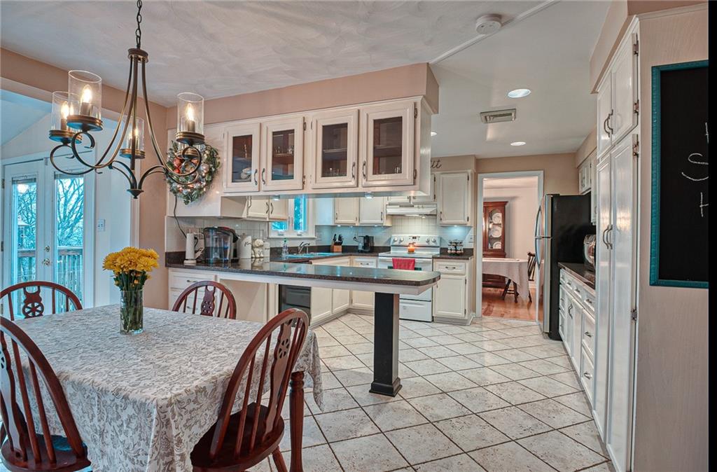 3223 Ridgeway Road Greensburg, PA 15601 - Photo 9 of 25 FULLY EQUIPPED EAT IN KITCHEN: White backsplash, undercabinet lighting & lots of cabinet space.