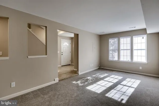 an empty room with windows