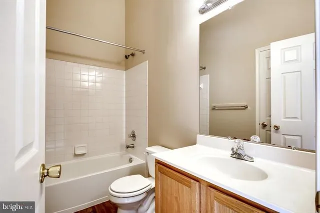 a bathroom with a sink toilet tub and shower