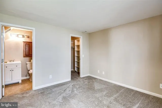 an empty room with closet area