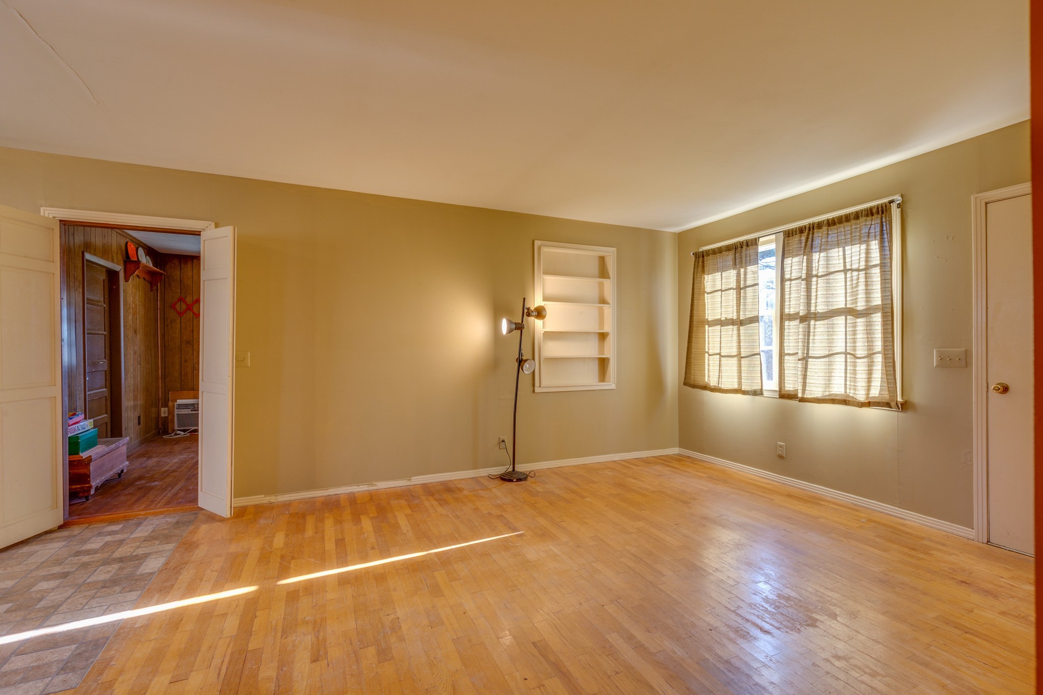 5676 Bending Chestnut Road Franklin, TN 37064 - Photo 14 of 38 an empty room with wooden floor and windows