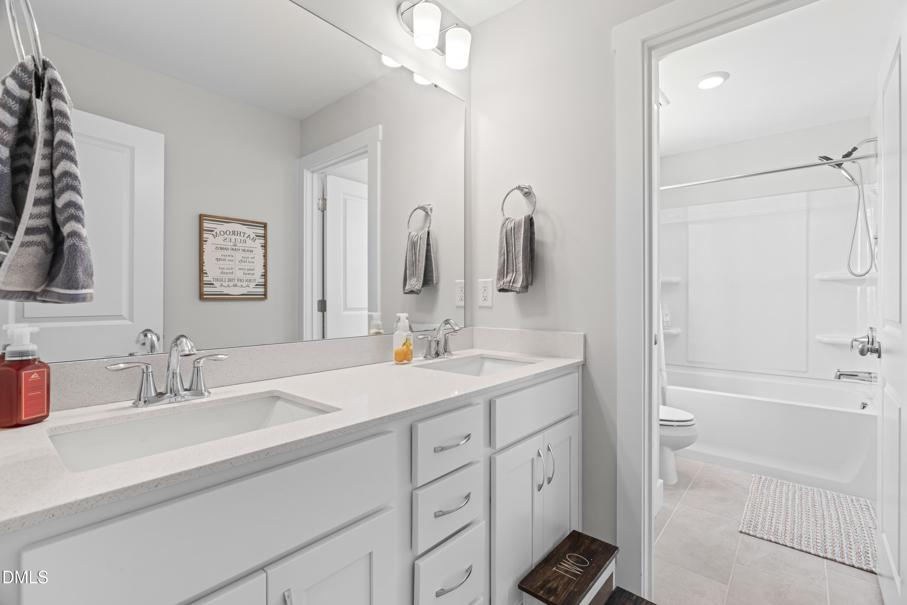 108 Bridge Street Smithfield, NC 27577 - Photo 32 of 48 a bathroom with a double vanity sink mirror and