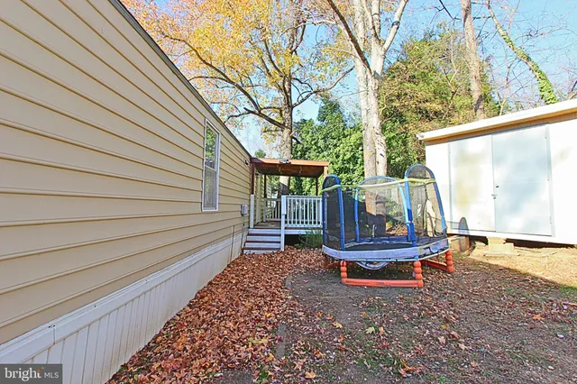 a bench sitting in front of a house