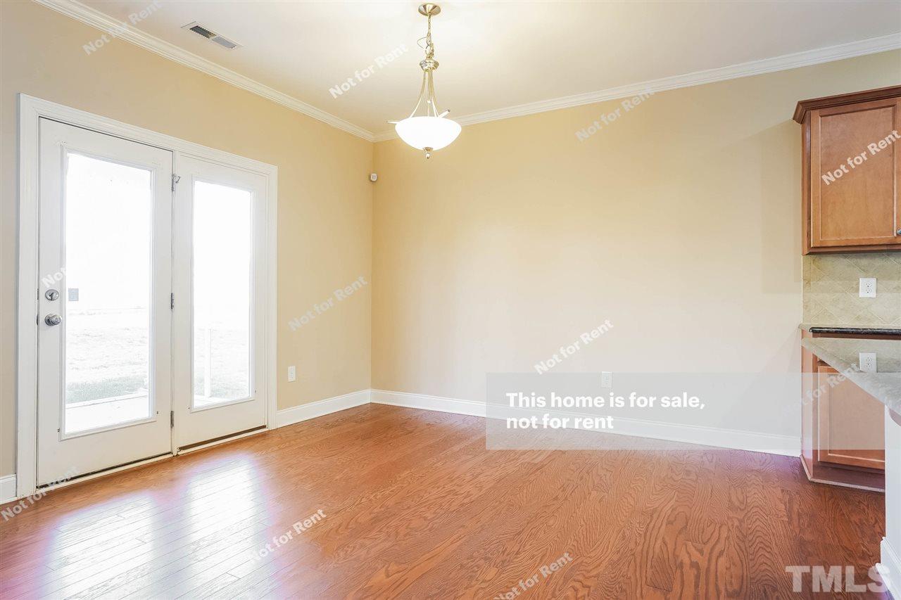 7549 Channery Way Raleigh, NC 27616 - Photo 12 of 27 a view of a room with wooden floor and a window