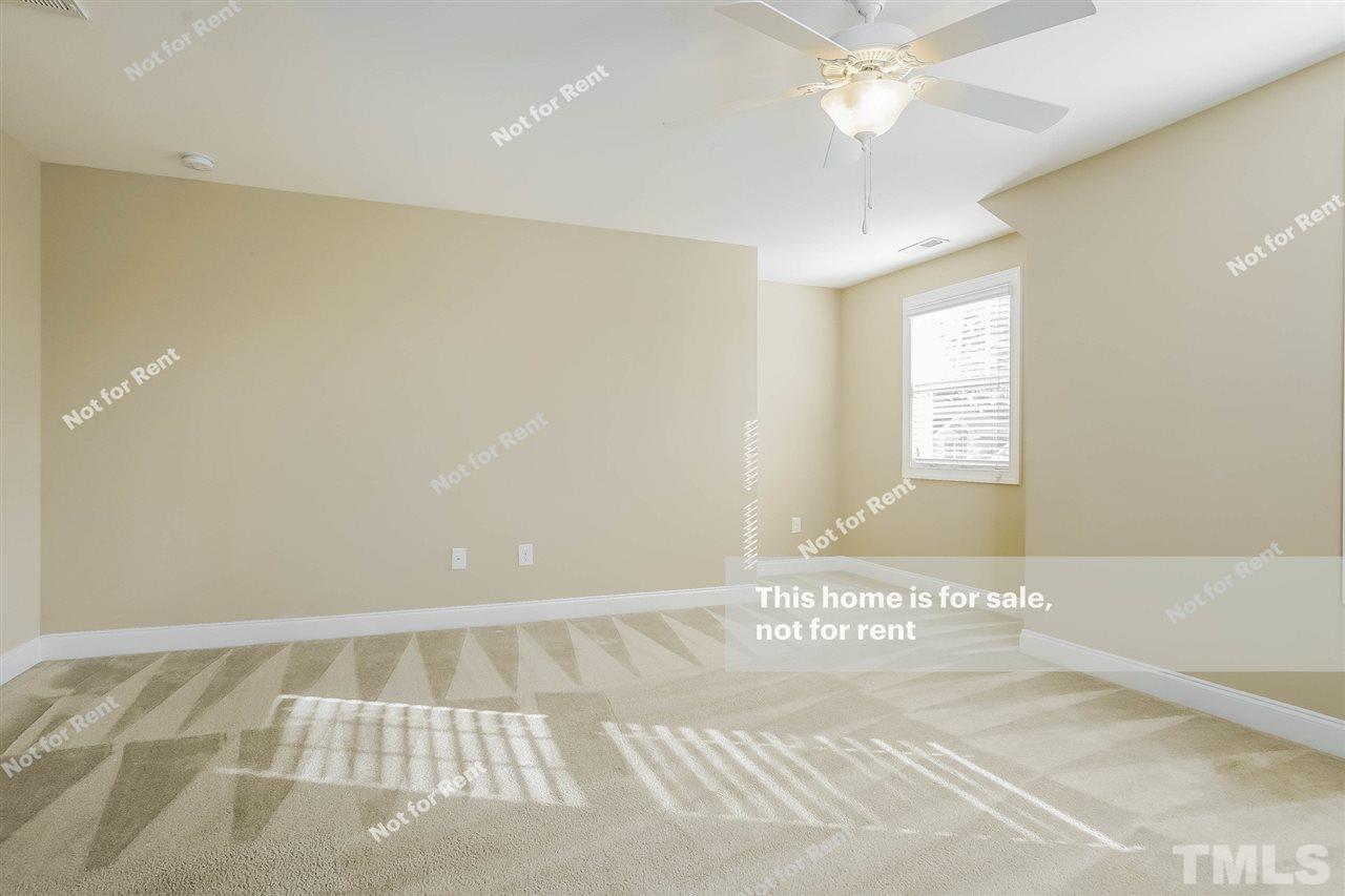 7549 Channery Way Raleigh, NC 27616 - Photo 16 of 27 a view of an empty room with a window