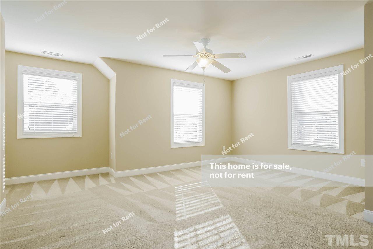 7549 Channery Way Raleigh, NC 27616 - Photo 17 of 27 a view of an empty room with a window