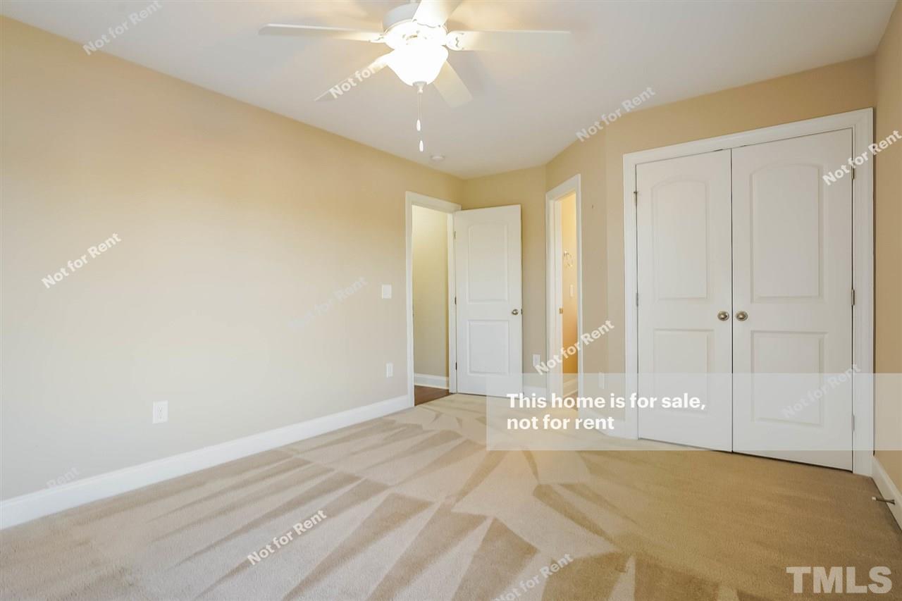 7549 Channery Way Raleigh, NC 27616 - Photo 18 of 27 a view of a livingroom with a staircase