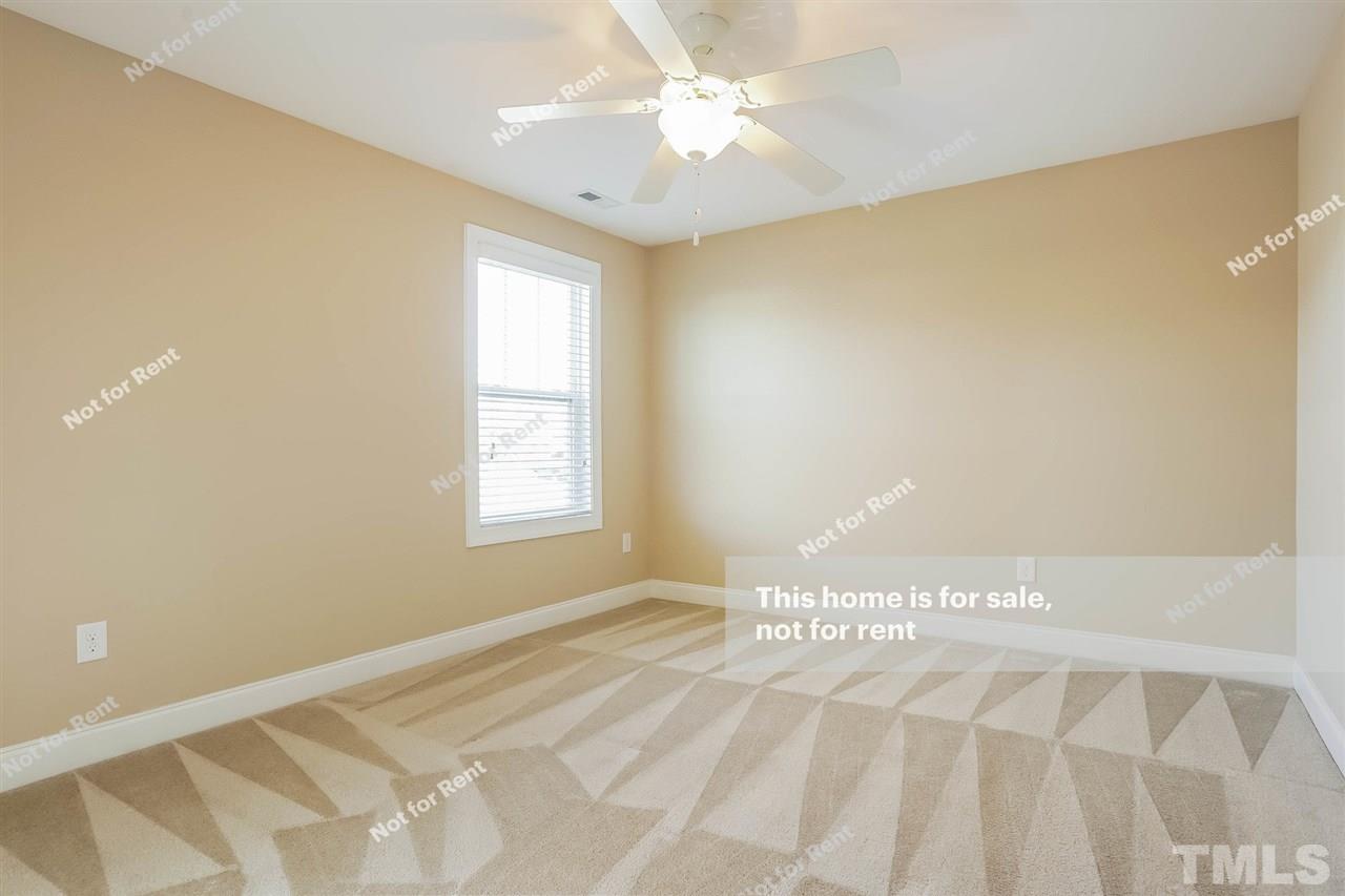 7549 Channery Way Raleigh, NC 27616 - Photo 23 of 27 a view of an empty room with a window