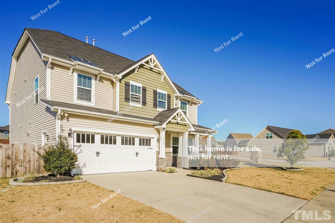 7549 Channery Way Raleigh, NC 27616 - Photo 8 of 27 a front view of a house with a yard