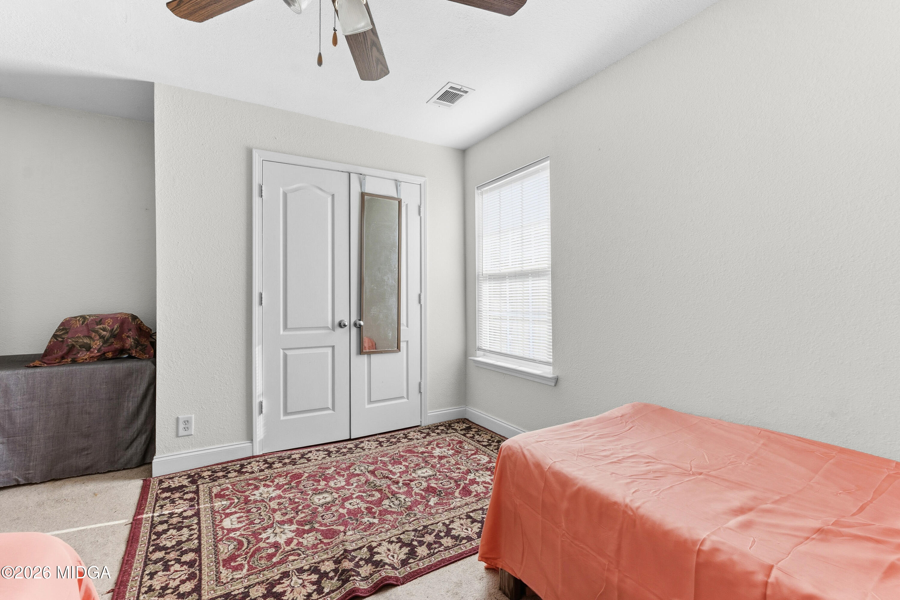 106 Shiloh Court Macon, GA 31206 - Photo 28 of 46 a bedroom with a bed and a chandelier fan