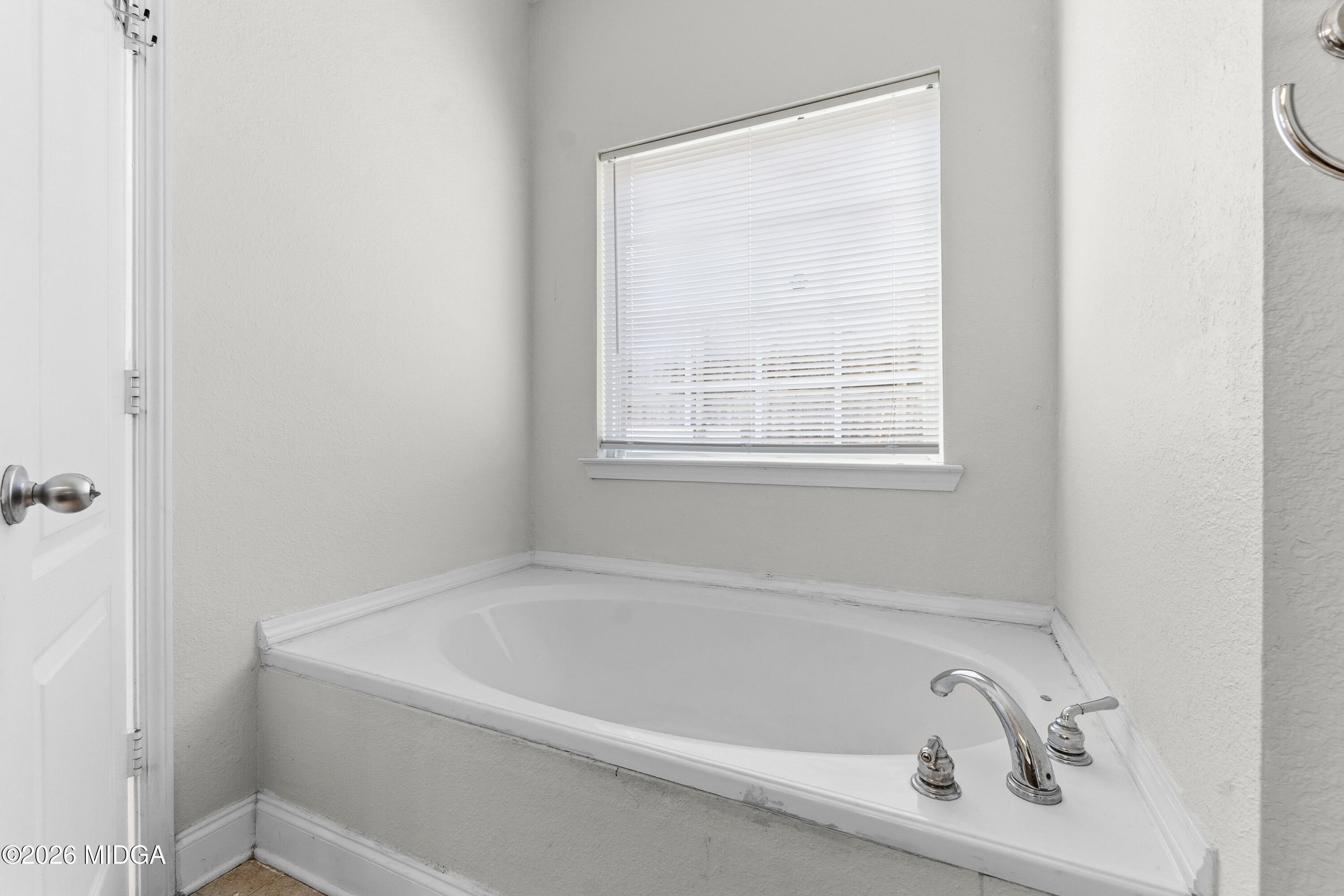 106 Shiloh Court Macon, GA 31206 - Photo 32 of 46 a white bath tub sitting next to a window