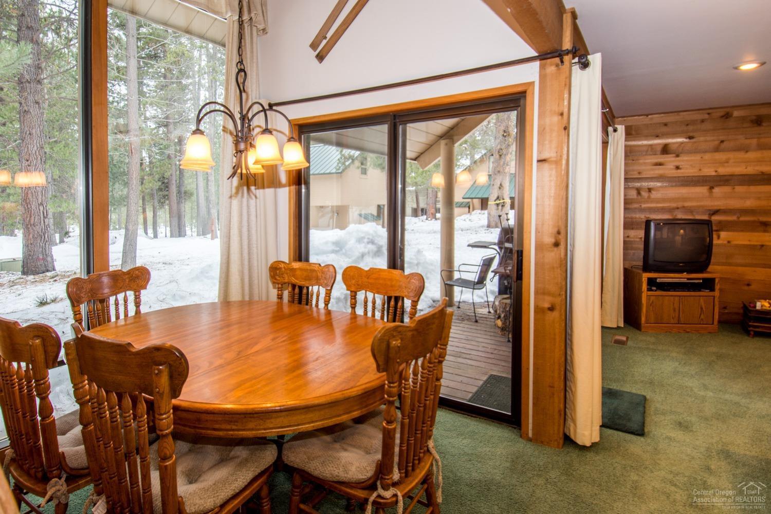 13 Ranch Cabin Road Sunriver, OR 97707 - Photo 5 of 21 a view of a dining room with furniture window and outside view